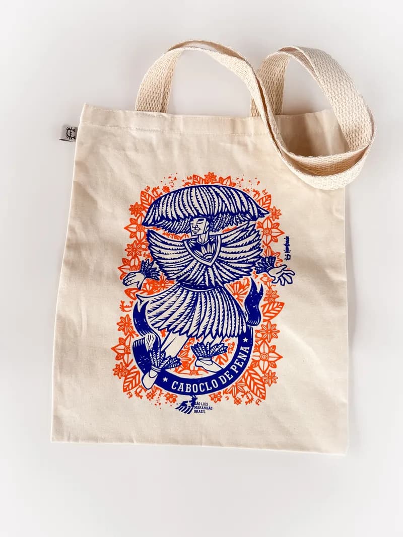 Ecobag de algodão cru estampada com o Caboclo de Pena em azul e laranja